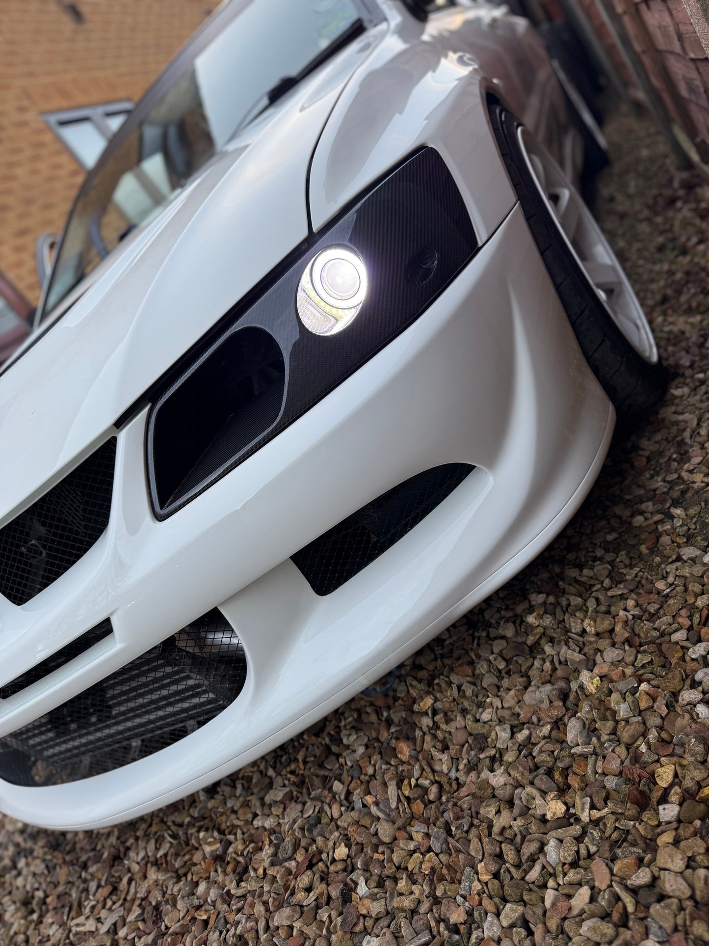 Mitsubishi Evo 7,8,9 Genuine Carbon fibre LED headlight vented air intake