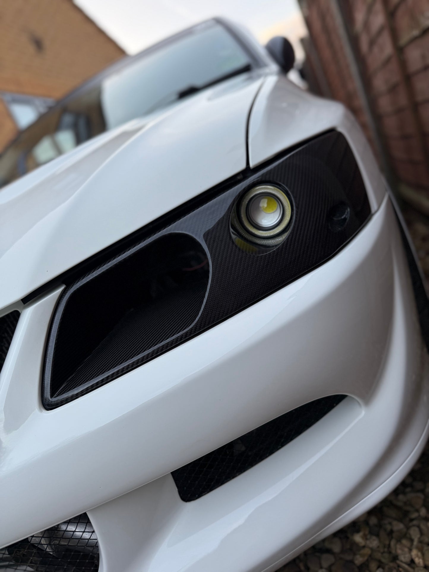 Mitsubishi Evo 7,8,9 Genuine Carbon fibre LED headlight vented air intake
