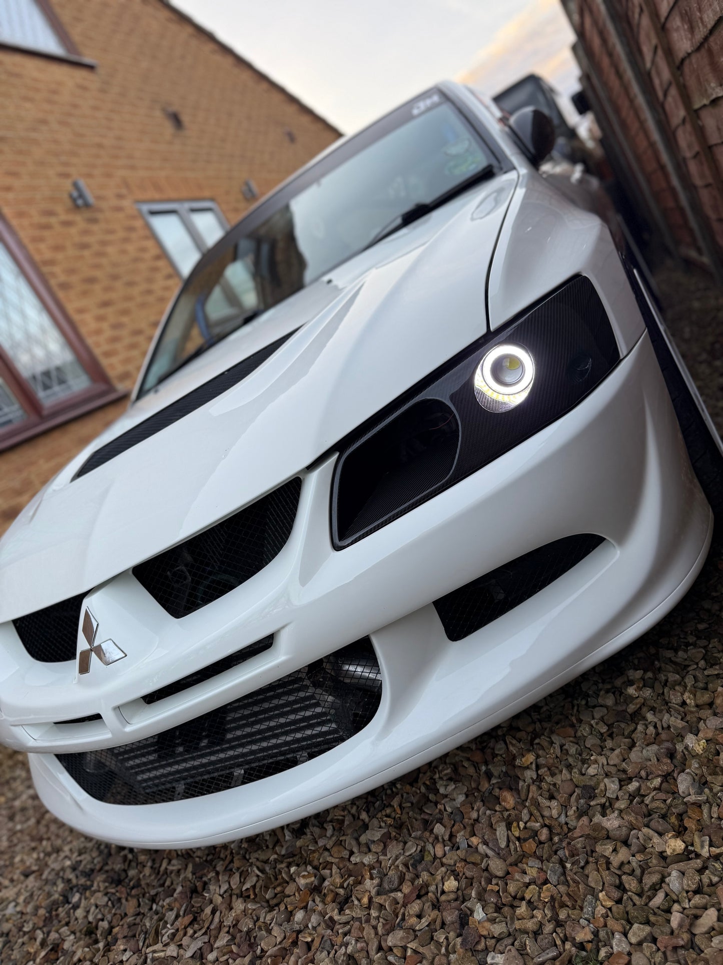 Mitsubishi Evo 7,8,9 Genuine Carbon fibre LED headlight vented air intake