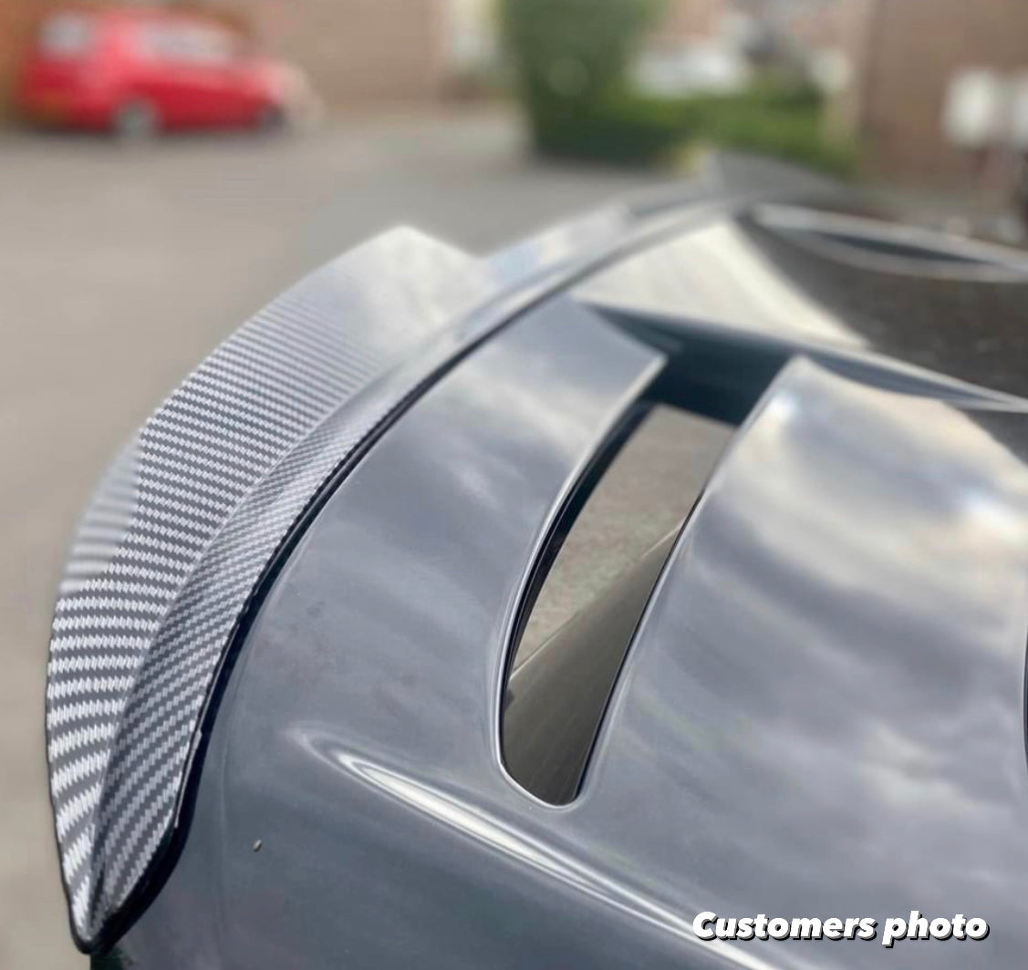 Defected Ford fiesta MK7 dipped carbon spoiler extension