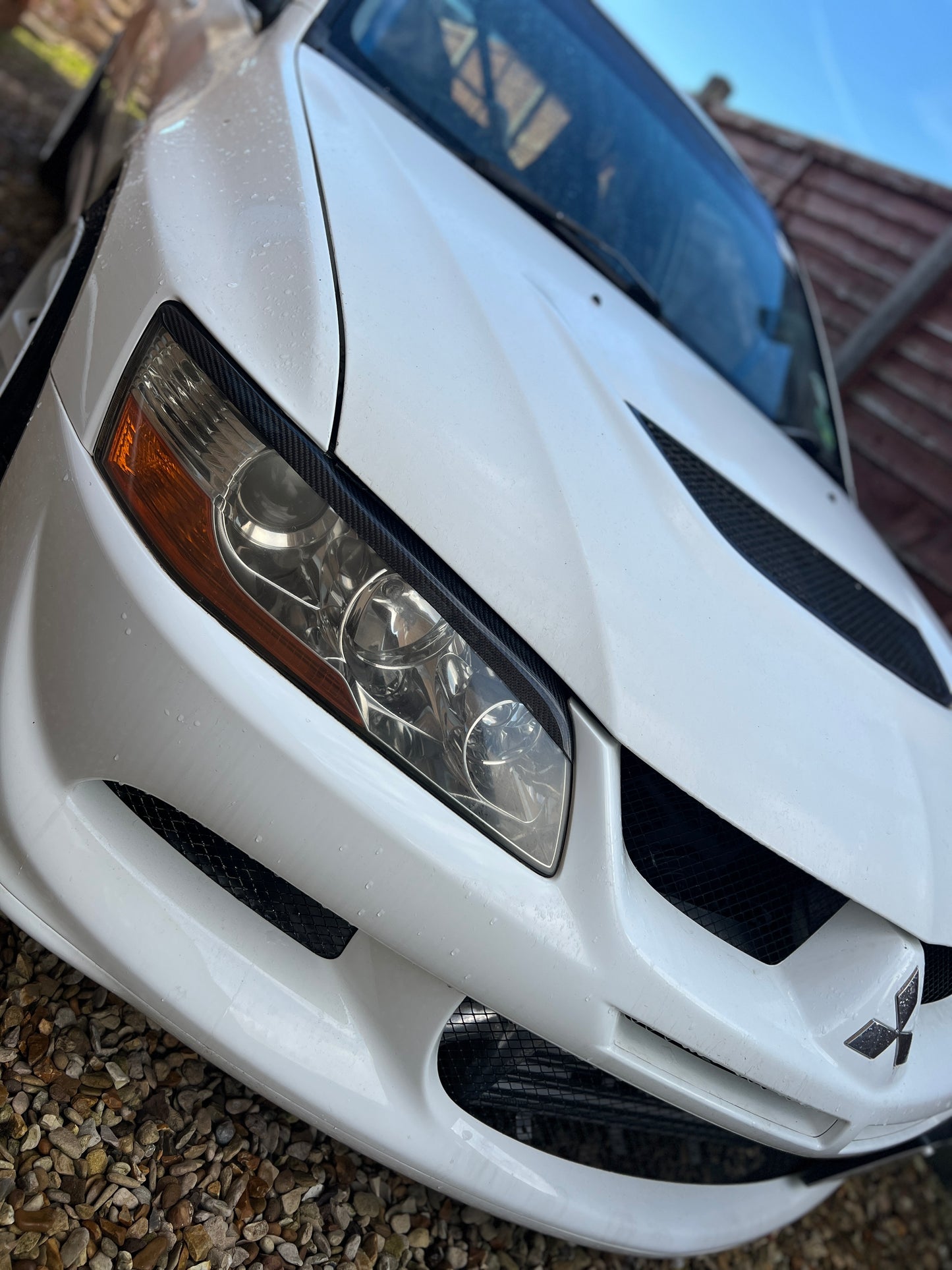 Mitsubishi Evo 7,8,9 genuine carbon fibre headlight eyebrows